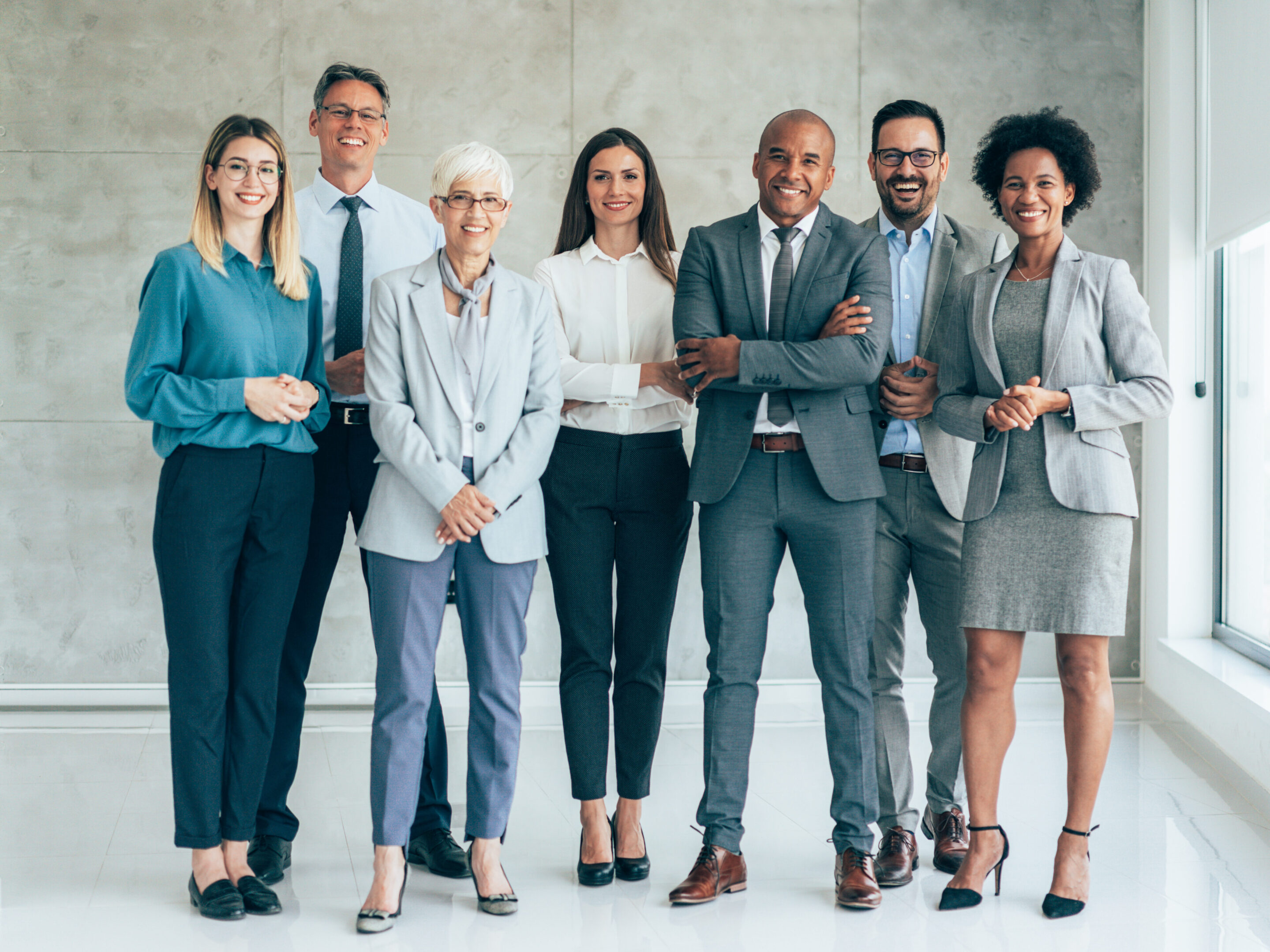 Diverse professional team posing in modern office